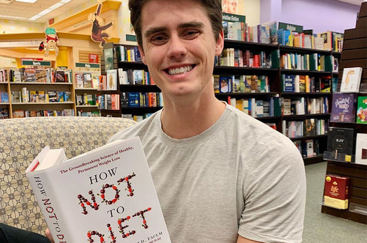 Austin Hendrickson reading in Navas Lab Apparel tall tee