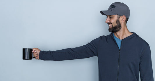 Tall guy wearing grey tall hoodie and flexfit baseball cap