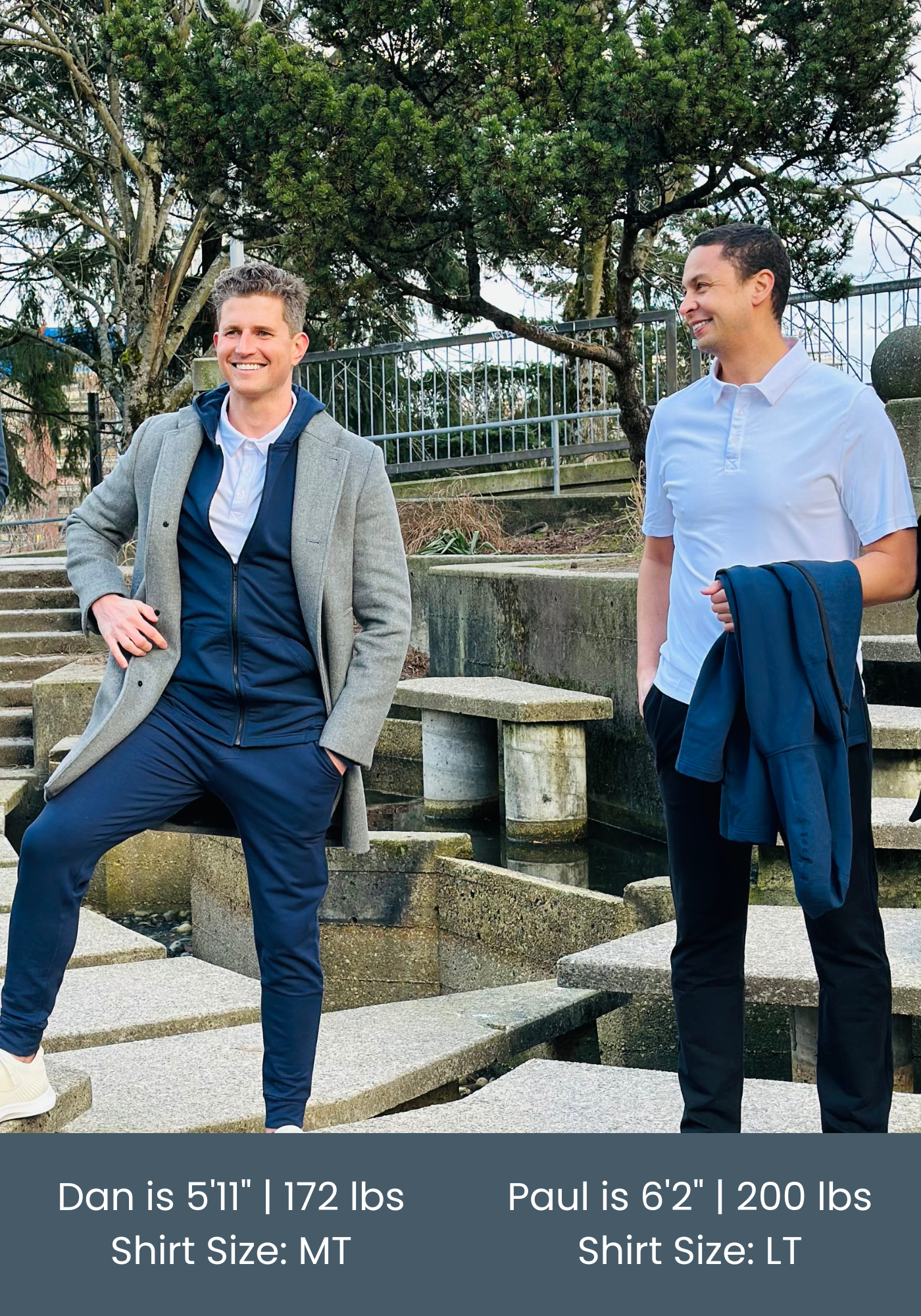 two tall men wearing navas lab polo shirt and lounge pants stood outside in front of concrete steps