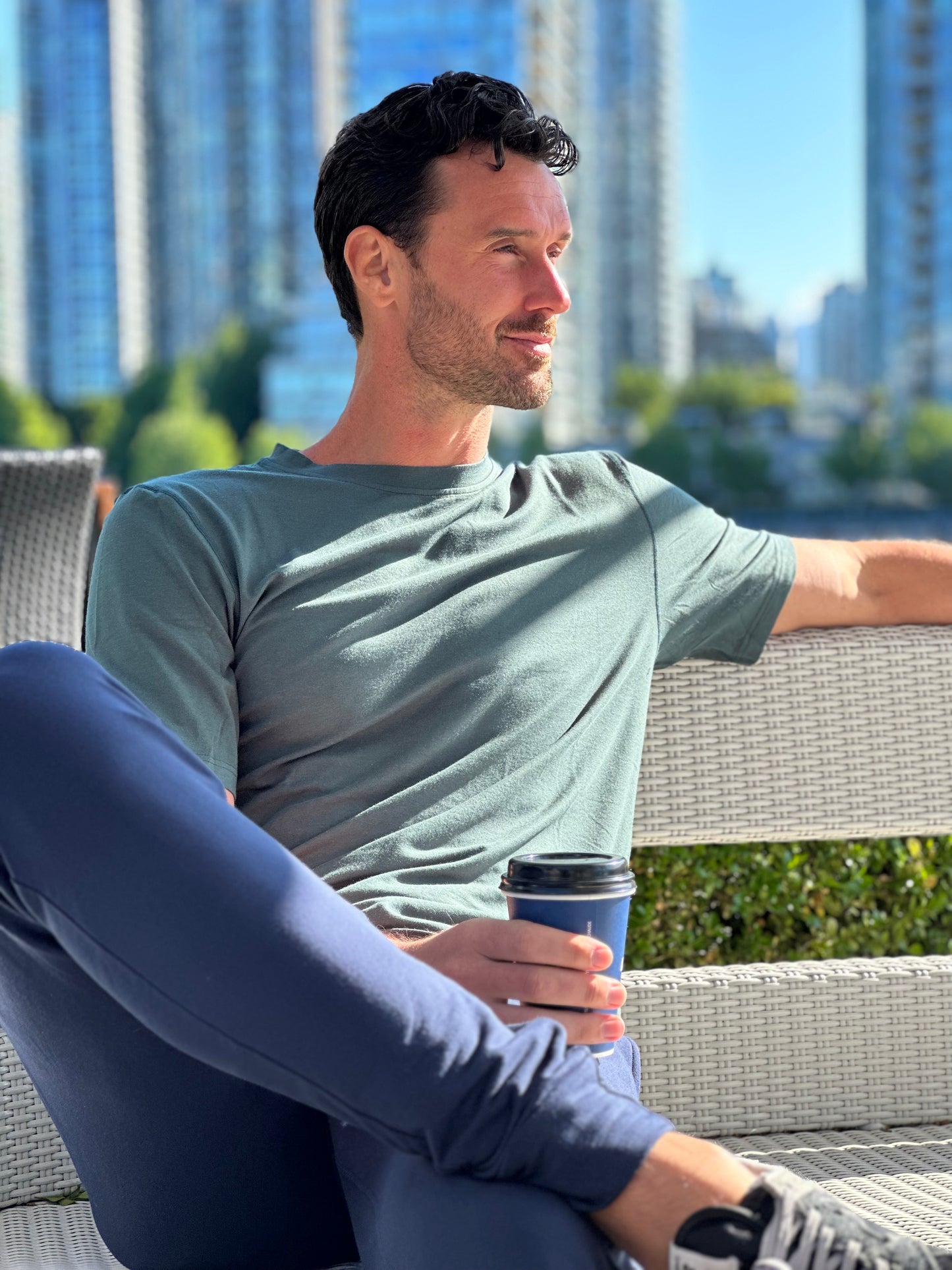 Tall Paul on Granville Island wearing Juniper Green Crowe Bamboo Tall T-shirt