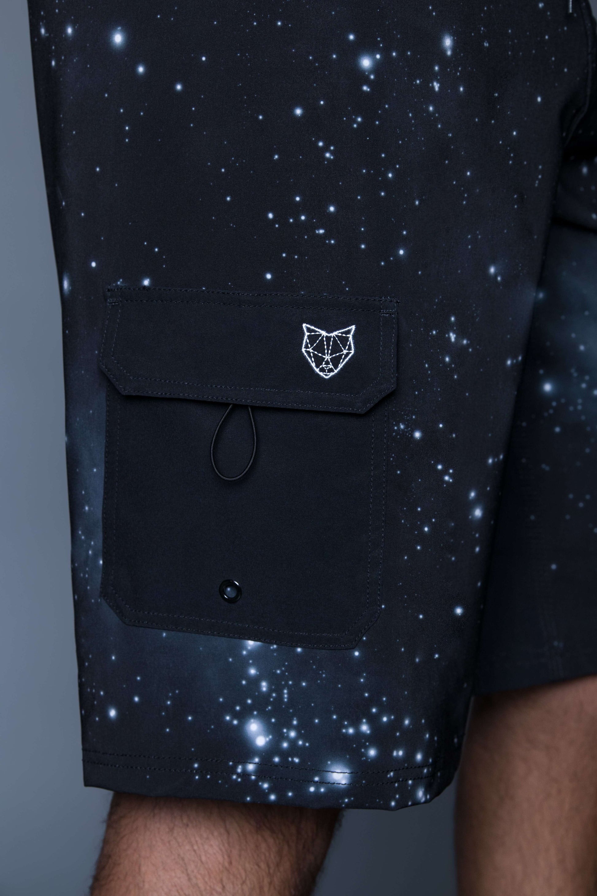 The Navas Lab Zod boardshorts for tall guys in space (black with white details) with pocket detail. The perfect boardshorts for tall men.
